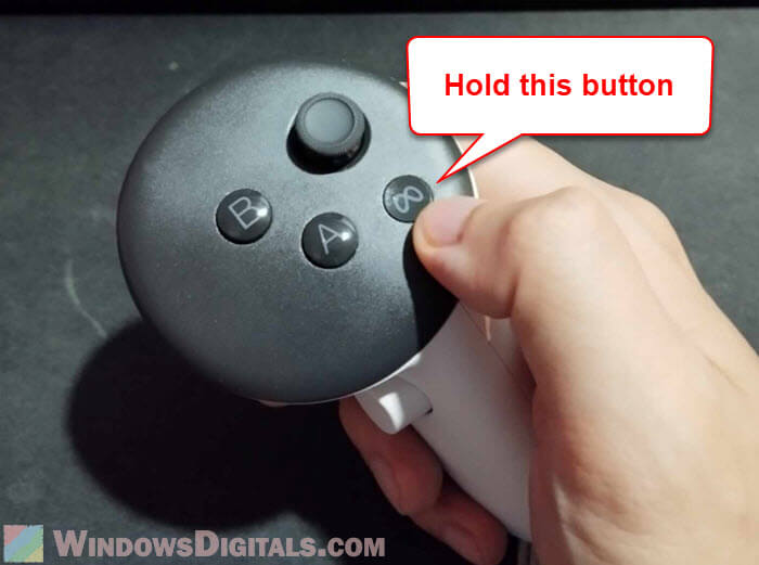 Hold Meta button on Oculus Quest 3 right controller